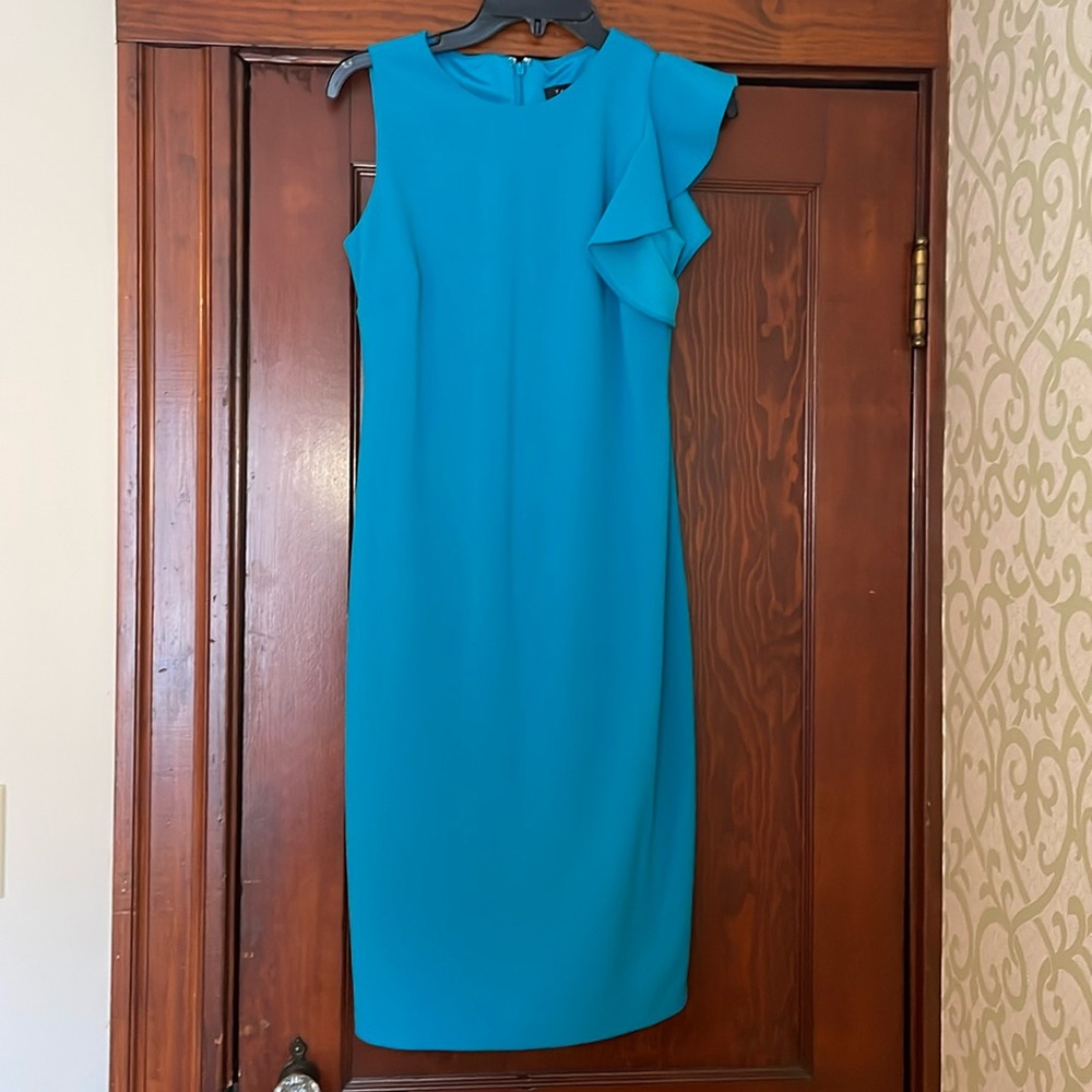 Tahari blue sheath dress featuring a side ruffle detail